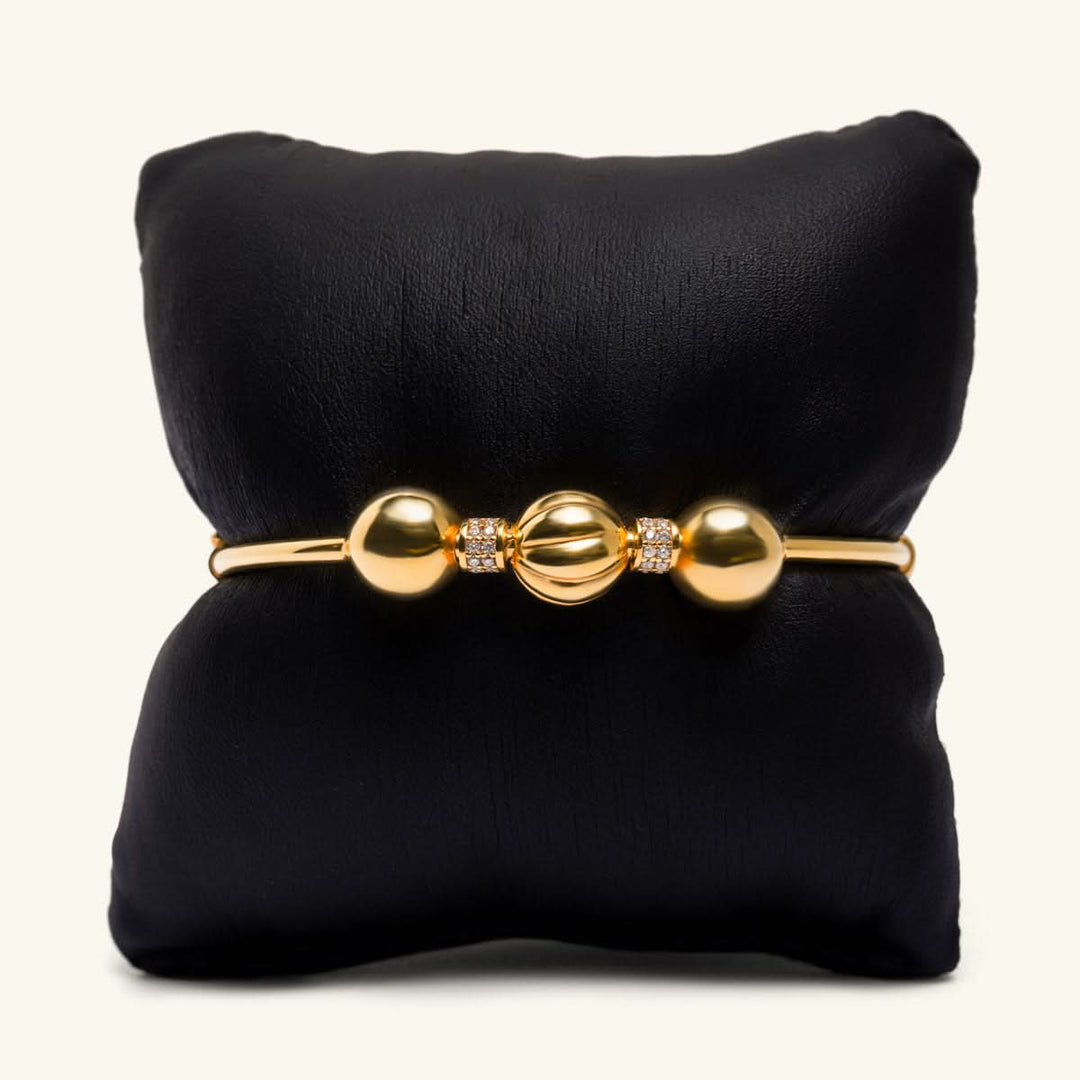 Gold Bangle with Elegant Bead Accents
