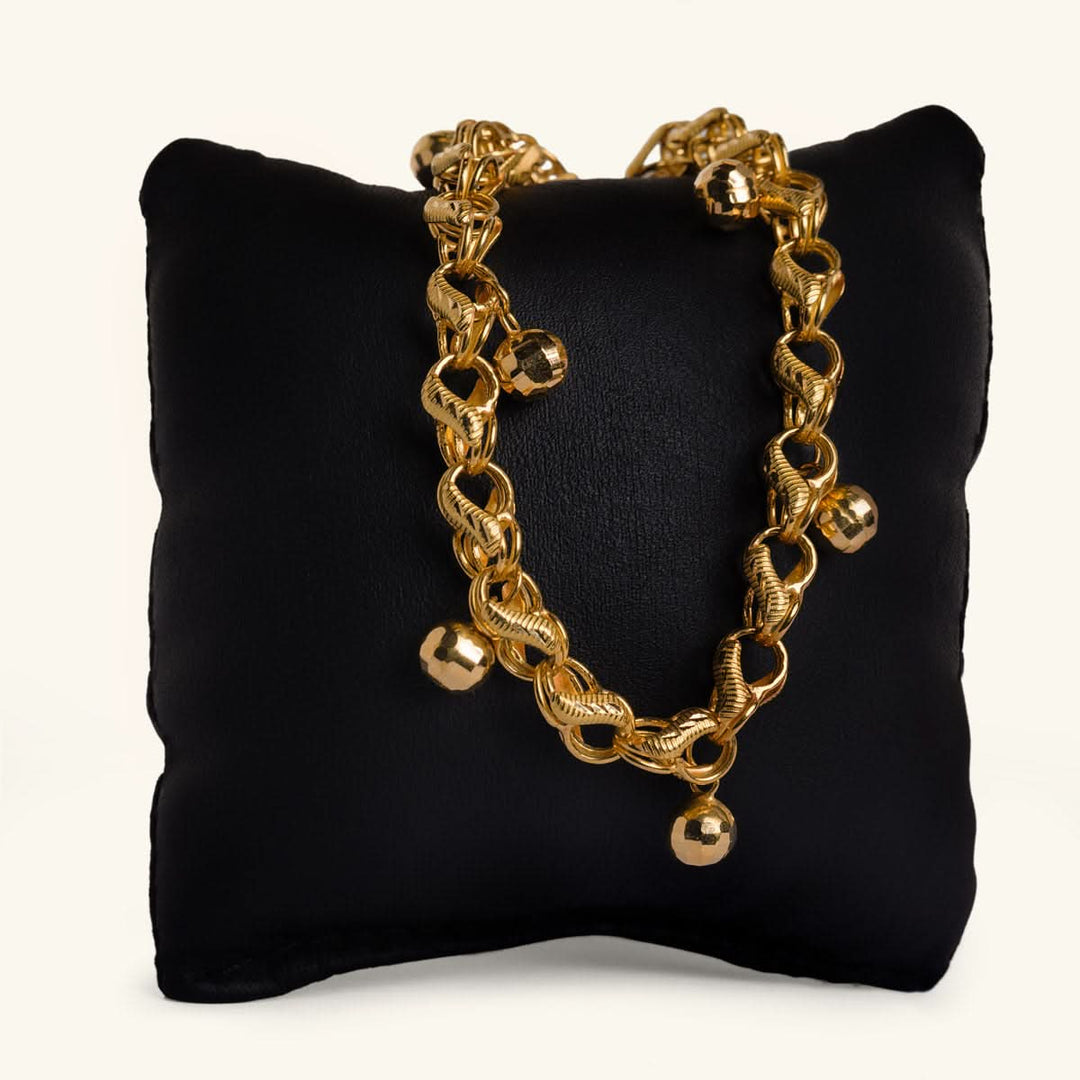 Gold Charm Bracelet with Textured Beads