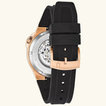Load image into Gallery viewer, Bulova automatic watch with stainless steel case and black dial, showcasing the elegant timepiece on a display stand.