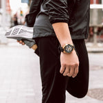 Load image into Gallery viewer, Bulova automatic watch with black leather strap and silver dial, showcasing the classic design of the Maquina model.