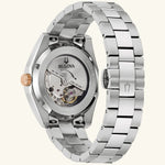 Load image into Gallery viewer, Bulova Surveyor automatic watch with rose gold case and red dial, showcasing a sleek and elegant design.