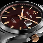 Load image into Gallery viewer, Bulova Surveyor automatic watch with rose gold case and red dial, showcasing a sleek and stylish timepiece.