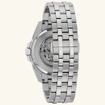 Load image into Gallery viewer, Bulova Sutton Classic blue skeleton dial automatic watch with stainless steel band and case, showcasing intricate dial details.