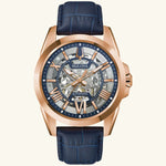 Load image into Gallery viewer, Bulova Sutton Classic watch with rose gold dial and blue strap, showcasing elegant design and sleek timepiece features.