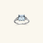 Load image into Gallery viewer, 10K Emerald-Cut Blue Topaz Ring with Diamond Accents
