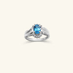 Load image into Gallery viewer, 10K Oval Blue Topaz &amp; Diamond Halo Ring

